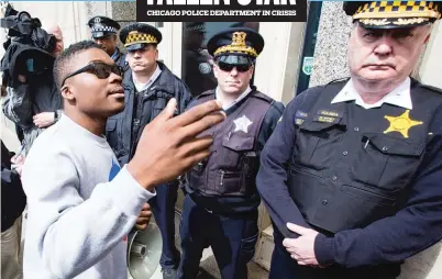  ?? | JAMES FOSTER/FOR THE SUN-TIMES ?? Ja’Mal Green confronts police outside the Fraternal Order of Police Lodge, 1412 W. Washington, to protest the union’s hiring of Jason Van Dyke, the CPD officer charged with the murder of Laquan McDonald.