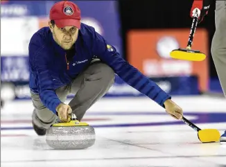  ?? REBECCA S. GRATZ/ASSOCIATED PRESS ?? John Shuster slides the stone at the U.S. Olympic Curling Team Trials in November in Omaha, Neb. The five-time Olympian is back to defend his curling gold medal in Beijing.