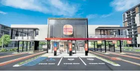  ?? Restaurant Brands Internatio­nal Design Team via © The New York Times Co. ?? This rendering show a Burger King with additional drive-thru lanes. Inspired by pandemic lessons that kept customers in cars, chains are adding more lanes and curbside pickup, improving apps and testing menu boards that use artificial intelligen­ce.