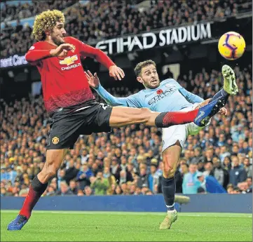  ?? AFP ?? ■ Manchester United midfielder Marouane Fellaini (left) vies with Manchester City's Bernardo Silva at the Etihad Stadium on Sunday.