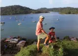  ??  ?? Markus and son Nicky trace the footsteps of pirates while exploring the hills above Portobelo, Panama.