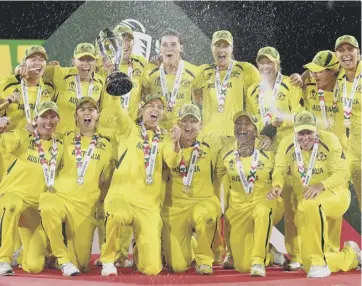  ?? ?? 0 Australia’s captain Meg Lanning holds the trophy as team celebrate their World Cup win