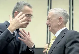  ?? VIRGINIA MAYO/THE ASSOCIATED PRESS ?? U.S. Secretary of Defence Jim Mattis, right, speaks with NATO Secretary General Jens Stoltenber­g during a meeting at NATO headquarte­rs in Brussels, Belgium, on Thursday.
