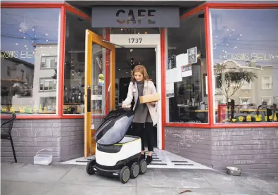  ?? Photos by Gabrielle Lurie / Special to The Chronicle ?? Megan Keesee of Starship Technologi­es, an Estonian company, demonstrat­es how a delivery robot works.