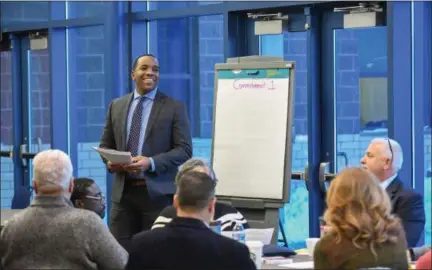  ?? ERIC BONZAR — THE MORNING JOURNAL ?? The work continued Jan. 17, as Lorain City Schools employees and civic leaders gathered in Lorain High School’s Performing Arts Atrium to do their part to fulfill The Lorain Promise. Chief Executive Officer David Hardy Jr. led the group in discussion...