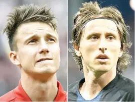  ?? AFP PHOTOS ?? Russia’s midfielder Alexander Golovin (left) and Croatia’s midfielder Luka Modric. SOCHI, Russia: