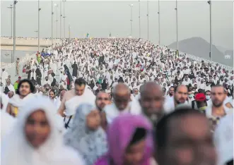  ?? MOSA’AB
ELSHAMY/ THE
ASSOCIATED
PRESS ?? Hundreds of thousands of Muslims gather on the first day of Eid al- Adha in Mina near Mecca Thursday for the annual hajj pilgrimage. Blaming this type of crowd for a stampede is a mistake, experts say, because it can be boiled down to the physical...