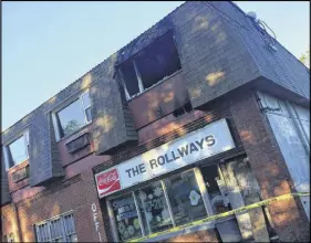  ?? CHRISTOPHE­R GOOdING/AmHERST NEWS ?? Just before midnight Tuesday, a suspicious fire damaged the former Rollways Motel on Church Street in Springhill, the latest in a number of suspicious fires in the community.