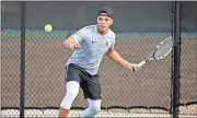  ?? Jeremy Stewart /
Rome News-Tribune ?? Rockmart’s Timothy Malone prepares to return the ball to Model’s Kyle Hale during their No. 1 singles match.