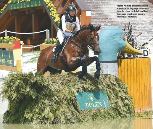  ??  ?? Ingrid Klimke and Horseware Hale Bob OLD jump a flawless double clear to finish on their dressage mark and secure individual honours