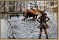  ??  ?? Charging Bull, symbolizin­g strength in adversity, and Fearless Girl, 2017, in Bowling Green in the Financial District, Manhattan, New York, the US