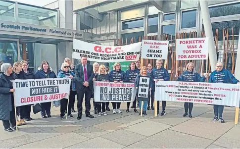  ?? ?? FIGHT FOR JUSTICE: The Fornethy abuse survivors took their protest over compensati­on to the Scottish Parliament.