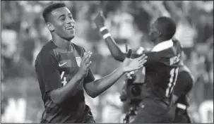  ?? The Associated Press ?? FIRST AND LAST: U.S. midfielder Tyler Adams (4) applauds fans Tuesday in Nashville, Tenn., after a 1-0 victory against Mexico in an internatio­nal friendly.