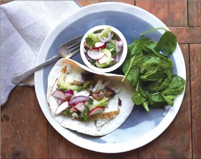  ?? Associated Press photo ?? This photo shows flaky fish tacos in New York.