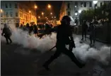  ?? MARTIN MEJIA — THE ASSOCIATED PRESS ?? Tear gas is returned to police trying to break up supporters of ousted President Pedro Castillo at plaza San Martin in Lima, Peru, on Sunday.