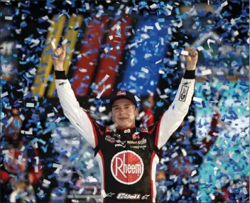  ?? JAMES GILBERT — GETTY IMAGES ?? Christophe­r Bell celebrates winning the NASCAR round-of-eight race at Homestead-Miami Speedway on Sunday.