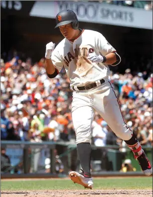  ?? ARIC CRABB/TRIBUNE NEWS SERVICE ?? The San Francisco Giants' Jae-Gyun Hwang celebrates as he crosses home plate after his sixthinnin­g home run against the Colorado Rockies on Wednesday in San Francisco.