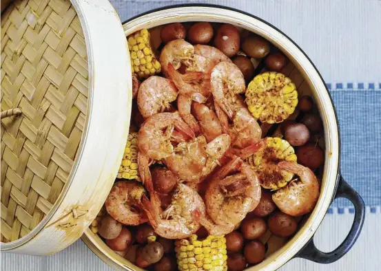  ?? Photos by Paul Stephen / Staff ?? Beer-Steamed Shrimp Boil uses beer in place of water to impart flavor. This recipe and more, page D8