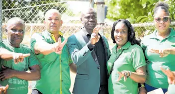  ?? RICARDO MAKYN/CHIEF PHOTO EDITOR ?? St Thomas Western Member of Parliament James Robertson (second left) with the Jamaica Labour Party’s candidate for the Trinityvil­le division, Dean Jones (third left), and party supporters on nomination day.