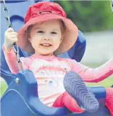  ?? DIANE CROCKER/SALTWIRE NETWORK ?? Three-year-old Lucy Martin was happy to get back to the playground at Margaret Bowater Park in Corner Brook Thursday. Lucy’s mom, Renee Martin, told her they couldn’t use the playground while it was closed due to the COVID-19 pandemic because of the bad germs.