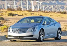  ?? CADILLAC PHOTOS ?? The 2014 Cadillac ELR, which starts at $76,990, is a plug-in-electric hybrid that can go about 35 miles before the 1.4-liter, 4-cylinder gasoline engine kicks in.