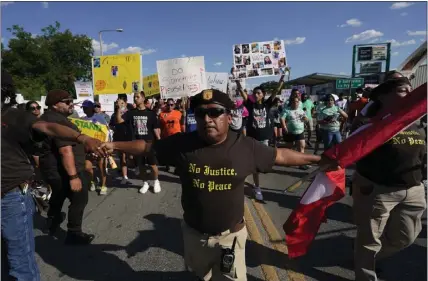  ?? ERIC GAY — THE ASSOCIATED PRESS ?? Escorted by the Texas Brown Berets, family and friends of those killed and injured in the school shootings at Robb Elementary take part in a protest march and rally July 10in Uvalde, Texas. Families and residents are seeking answers and changes after the tragedy.