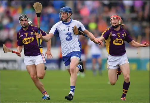  ??  ?? Waterford talisman Austin Gleeson breaking away from Eanna Martin and Diarmuid O’Keeffe during last year’s quarter-final clash in Thurles.