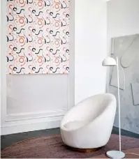  ??  ?? DOODLE JAFFA WITH ITS STRIKING ORANGE, BLACK
AND WHITE SWIRLS, the Doodle Jaffa print roller blind is colourful and quirky, adding a touch of modern charm to any living room.