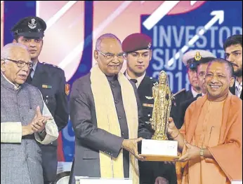  ?? DEEPAK GUPTA/HT PHOTO ?? UP chief minister Yogi Adityanath (right) presents a memento to President Ram Nath Kovind along with governor Ram Naik on the last Day of the UP Investors Summit2018 at the Indira Gandhi Pratishtha­n in Lucknow on Thursday.