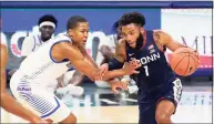  ?? Charles Rex Arbogast / Associated Press ?? UConn’s R.J. Cole (1) drives against DePaul’s Charlie Moore during the first half on Monday in Chicago.