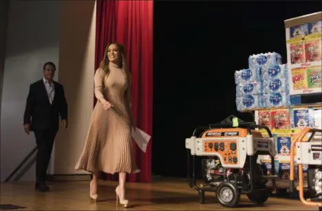  ?? THE ASSOCIATED PRESS ?? New York Gov. Andrew Cuomo, left and Jennifer Lopez walk on stage before announcing new hurricane recovery efforts for Puerto Rico Sunday in New York.