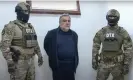  ?? Photograph: State Security Service Of Azerbaijan/ EPA ?? Vardanyan is escorted by Azerbaijan security service officers after being detained while trying to cross into Armenia.