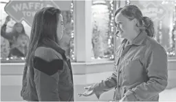  ??  ?? Anna Akana, left, and Liv Hewson appear in a scene from Netflix’s holiday movie, “Let It Snow.”