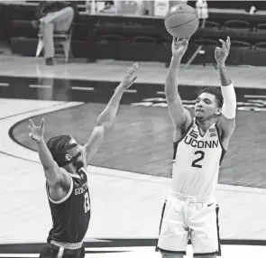  ?? DAVID BUTLER II/USA TODAY SPORTS ?? Connecticu­t guard James Bouknight shoots against Georgetown on Saturday in Storrs, Conn.