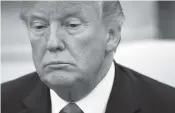  ?? AP PHOTO BY EVAN VUCCI ?? President Donald Trump listens Wednesday during a meeting with European Commission president JeanClaude Juncker in the Oval Office of the White House.