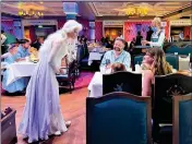  ?? ?? “Frozen”-themed dinners with entrees like sea bass and steak come standard aboard the Disney Wish cruise ship.