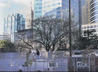  ?? DAVID JOLES/STAR TRIBUNE VIA AP ?? Media trucks set up Thursday near the Hennepin County Government Center in Minneapoli­s. Derek Chauvin’s murder trial is scheduled to begin Monday.