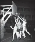  ?? ASSOCIATED PRESS FILE ?? American armed forces contest a rebound during a basketball tournament March 31, 1943, in London to crown a European champion.