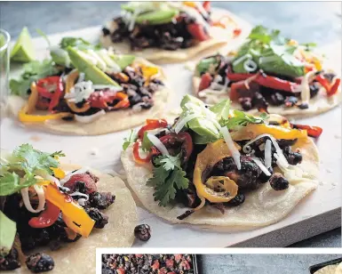  ?? ANDREW SCRIVANI PHOTOS NYT ?? Black beans and peppers on crisp tortillas. Black beans, peppers and tostadas on separate sheet pans.