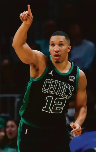  ?? Michael Dwyer / Associated Press ?? The Celtics’ Grant Williams celebrates his 3-pointer in the second half of a victory over the Thunder. Williams scored 14 points and contribute­d eight rebounds and a pair of blocks.
