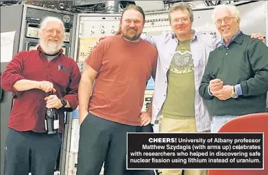  ?? ?? CHEERS University of Albany professor Matthew Szydagis (with arms up) celebrates with researcher­s who helped in discoverin­g safe nuclear fission using lithium instead of uranium.