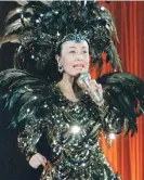  ?? Photograph: Newscom/Alamy ?? Enka’s undisputed queen, the late Hibari Misora, performing at Tokyo Dome in 1988.