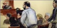  ?? THE ASSOCIATED PRESS ?? In this courtroom sketch, defendant Ahmad Khan Rahimi, center, interrupts presiding U.S. District Court Judge Richard Berman on the first day of his trial in federal court in New York on Monday.