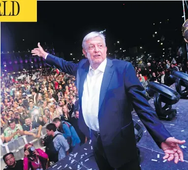  ?? PEDRO PARDO / AFP / GETTY IMAGES ?? Newly elected Mexican President Andres Manuel López Obrador, running for the “Juntos haremos historia” party, cheers his supporters at the Zocalo Square in Mexcio City Sunday after emerging victorious in the country’s election.