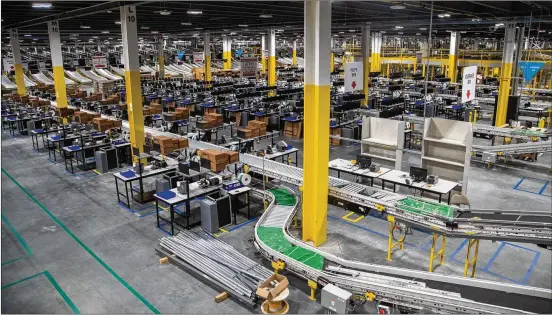  ?? PHOTOS BY ALYSSA POINTER / ALYSSA.POINTER@AJC.COM ?? The Amazon ATL2 Fulfillmen­t Center near Stone Mountain is 700,000 square feet. If the new planned facility has 1,000 employees, Amazon would become one of Gwinnett County’s largest private employers. Metro Atlanta added 15,300 jobs during July, but the area’s unemployme­nt rate was 8.5%.