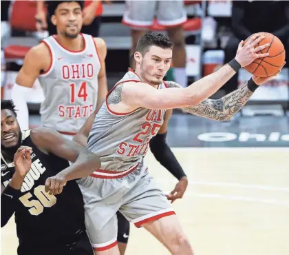 ?? ADAM CAIRNS/COLUMBUS DISPATCH ?? In four years at Ohio State, senior forward Kyle Young (25) has forged a strong relationsh­ip with coaches and fans who appreciate his willingnes­s to work in the hard areas.