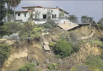  ?? Gary Coronado Los Angeles Times ?? CASA ROMANTICA, a landmark 1927 property used as a cultural center, was damaged by an April landslide and remains closed to visitors. The slide also brought passenger rail service on the beach below to a halt.