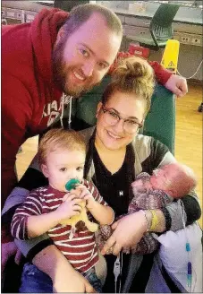  ?? Photograph submitted ?? Ryan and Bethany Thetford with big brother Max and baby Jet. Max had to wait until he turned 2 years old and had immunizati­ons before he could meet his brother Jet who he met for the first time Dec. 23. Ryan and Bethany are both graduates of Pea Ridge...