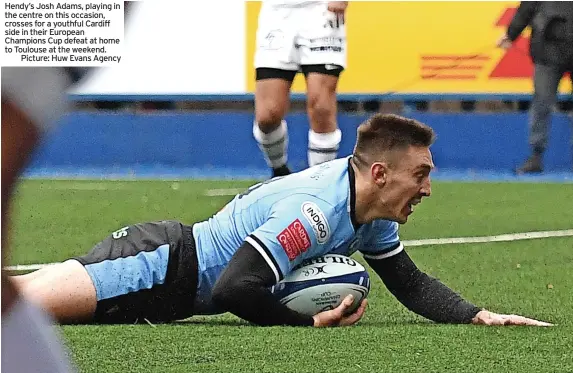  ?? ?? Hendy’s Josh Adams, playing in the centre on this occasion, crosses for a youthful Cardiff side in their European Champions Cup defeat at home to Toulouse at the weekend.
Picture: Huw Evans Agency