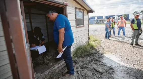  ?? Photos by Marie D. De Jesús / Staff photograph­er ?? “It’s super slow,” Albert Moreno-Valdez said while waiting on a shipment of motor oil. Moreno-Valdez first had to sign up at the terminal office.